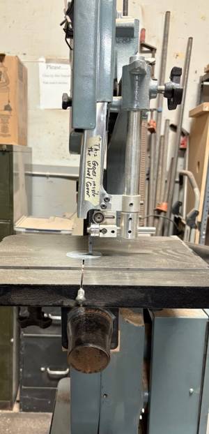 Delta bandsaw. The dust port is held on by a magnet. Delta bandsaw. The dust port is held on by a magnet.