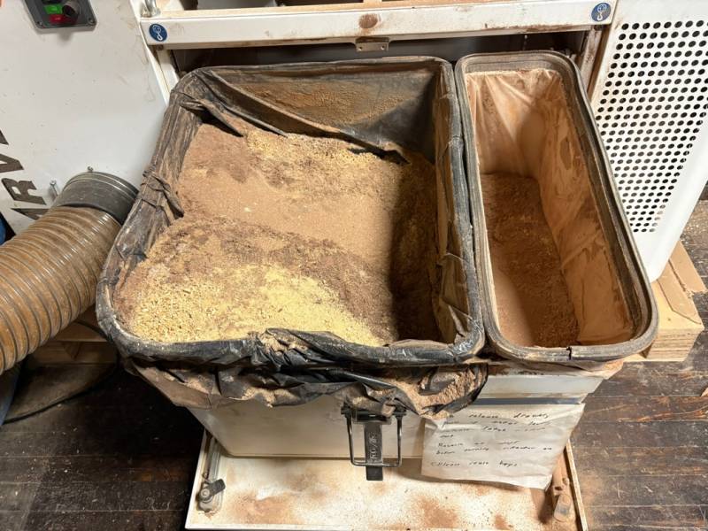 Large bin holds coarse chips. Small bin holds finer dust. Empty both before they are half full. Large bin holds coarse chips. Small bin holds finer dust. Empty both before they are half full.